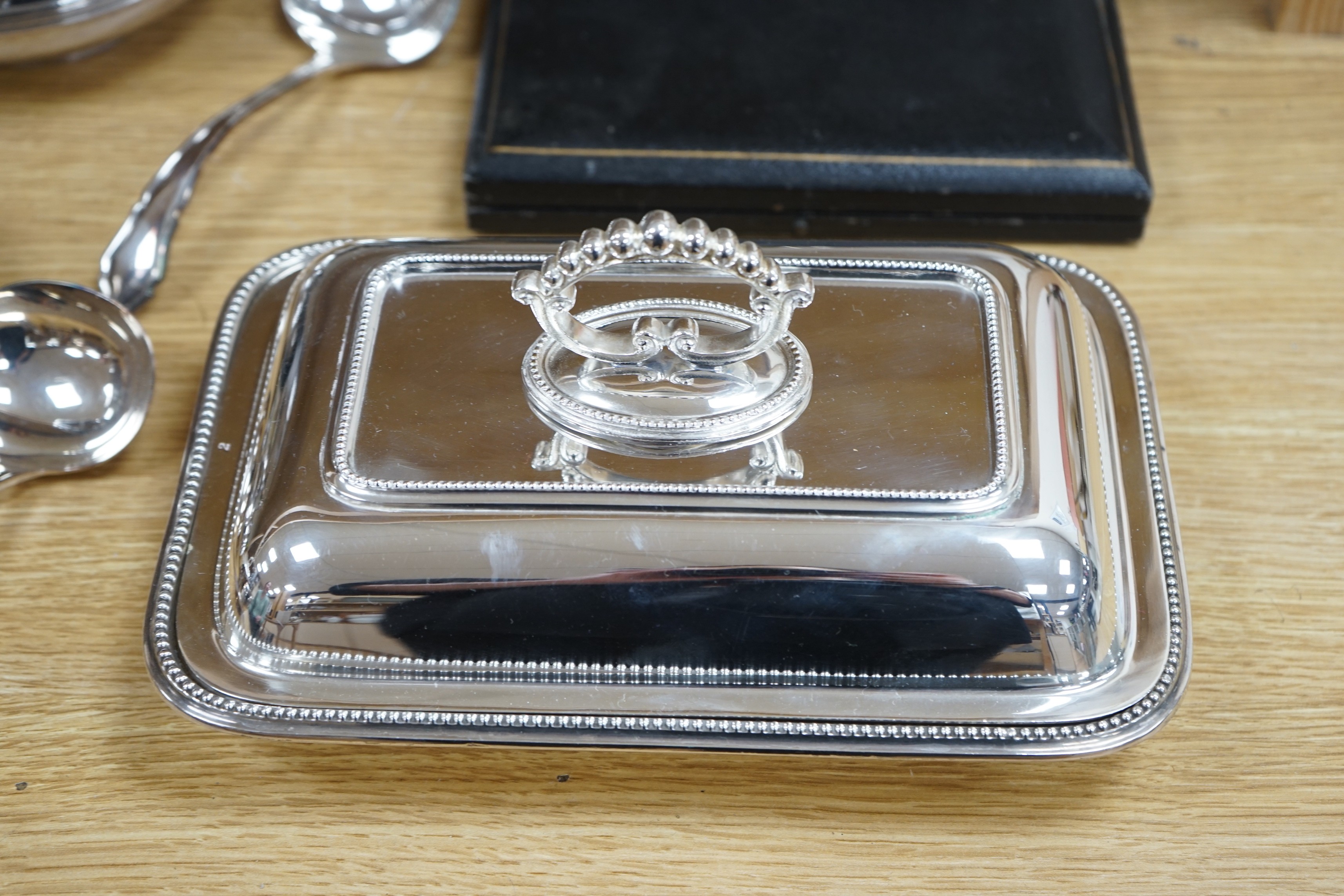 A quantity of silver plate including a cocktail shaker and a ewer